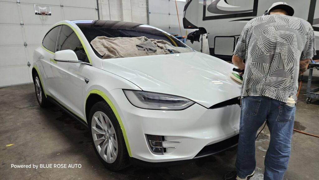 Applying ceramic coating on a vehicle in Eugene, OR, by Blue Rose Auto.