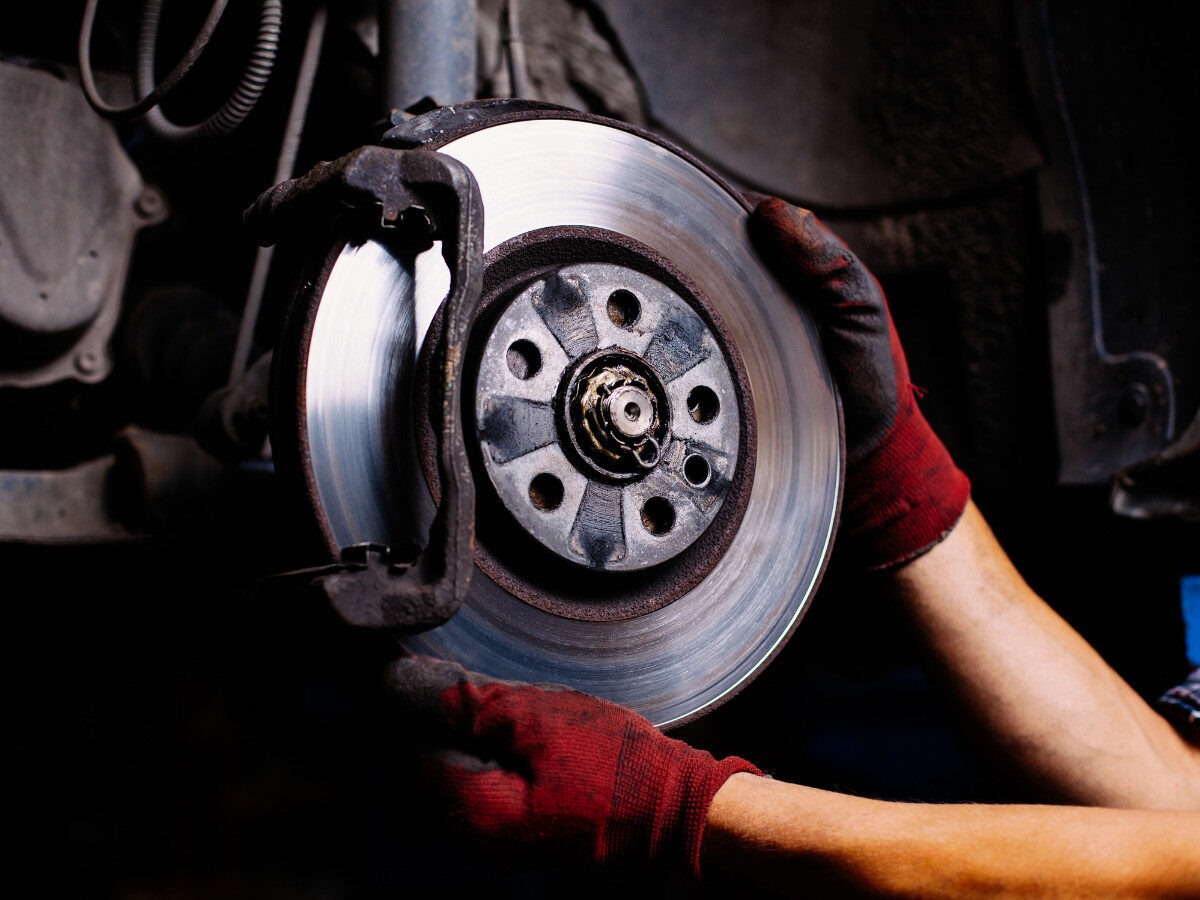 brake repair near me - a mechanic fixing the brake system