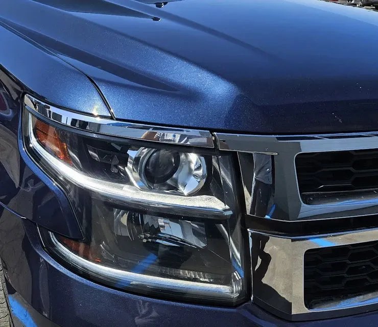 Headlight lens on a blue SUV being restored at Blue Rose Auto in Springfield, Oregon Headlight lens on a blue SUV being restored at Blue Rose Auto in Springfield, Oregon