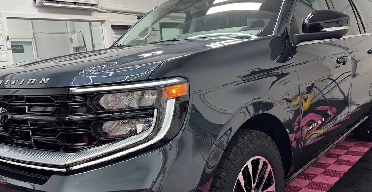 Freshly detailed gray SUV with clean, glossy car paint in the Blue Rose Auto detail bay in Springfield, OR